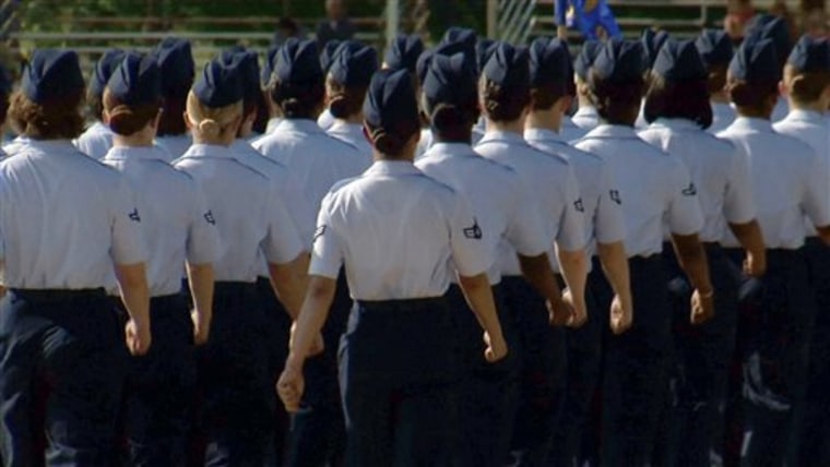 In this June 22, 2012, image made from video, female airmen march during graduation at Lackland Air Force Base in San Antonio. A widening sex scandal has rocked Lackland Air Force Base in Texas, one of the nation's busiest military training centers, where four male instructors are charged with having sex with, and in one case raping, female trainees. (AP Photo/John L. Mone)